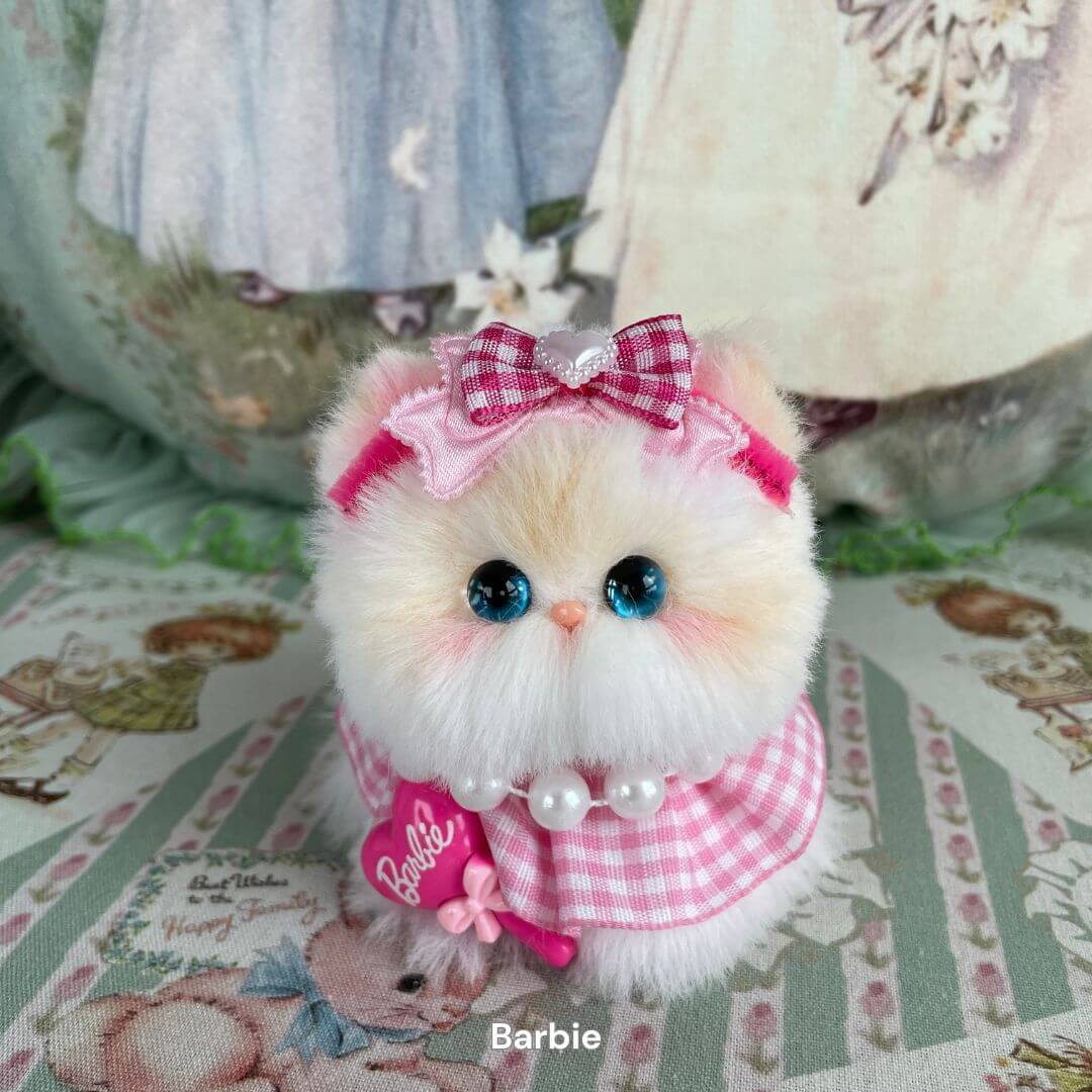 Handmade plush toy kitten in pink bow and gingham outfit, part of the Cosplay Kitten Collection, styled with fashion doll flair.
