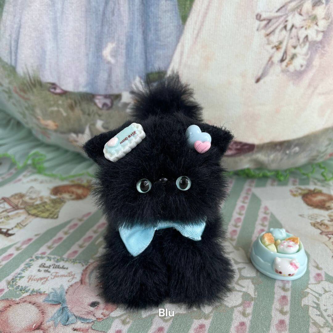 Handmade black kitten figurine with accessories, featuring soft faux fur and candy bow, part of the Black Kitten Collection.