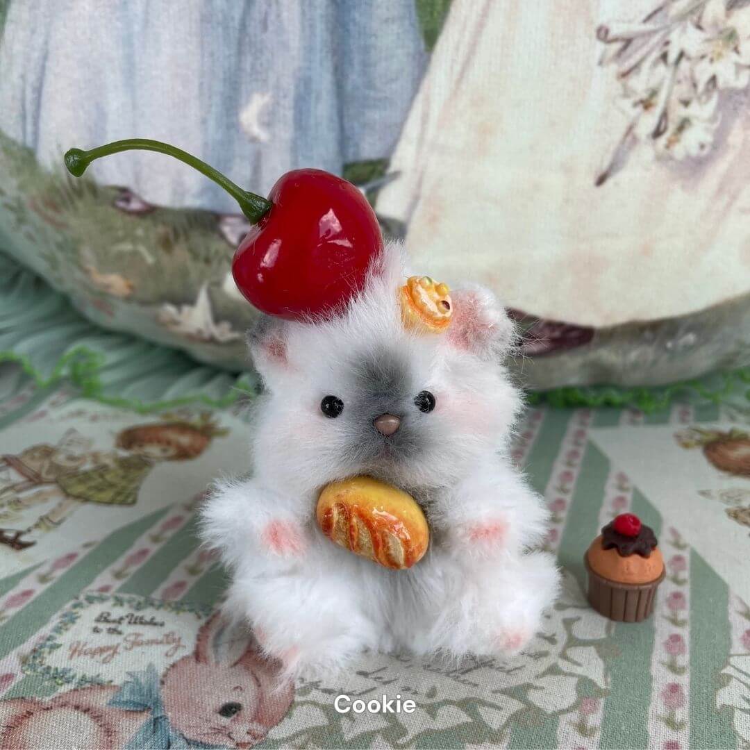 Handmade fluffy hamster with cherry and pastry decoration in the Adorable Hamsters Collection, ideal for pet-themed decor or gifts.