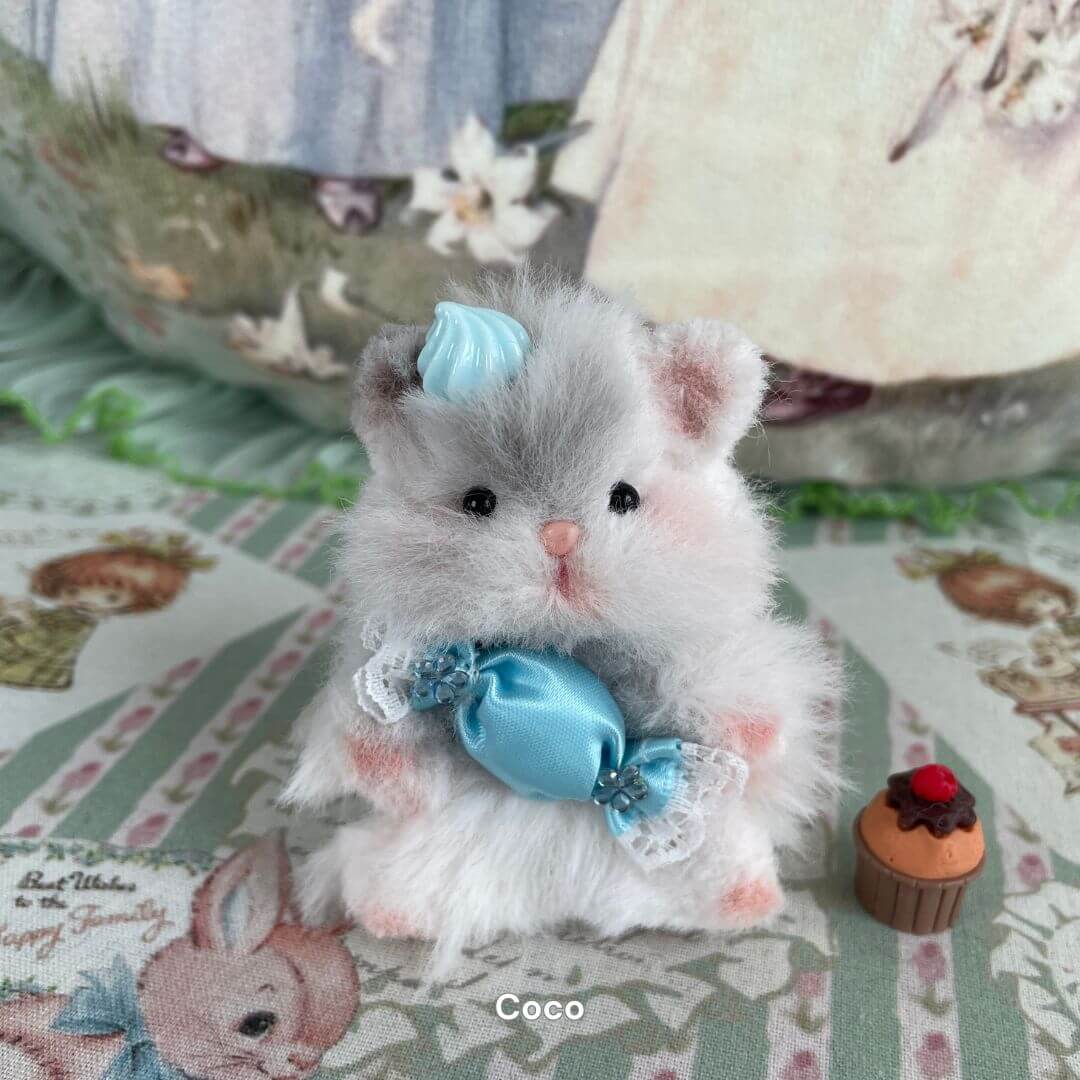 Adorable handmade grey hamster with blue bow and vintage lace, part of the Hamsters Collection, displayed with mini cupcake.