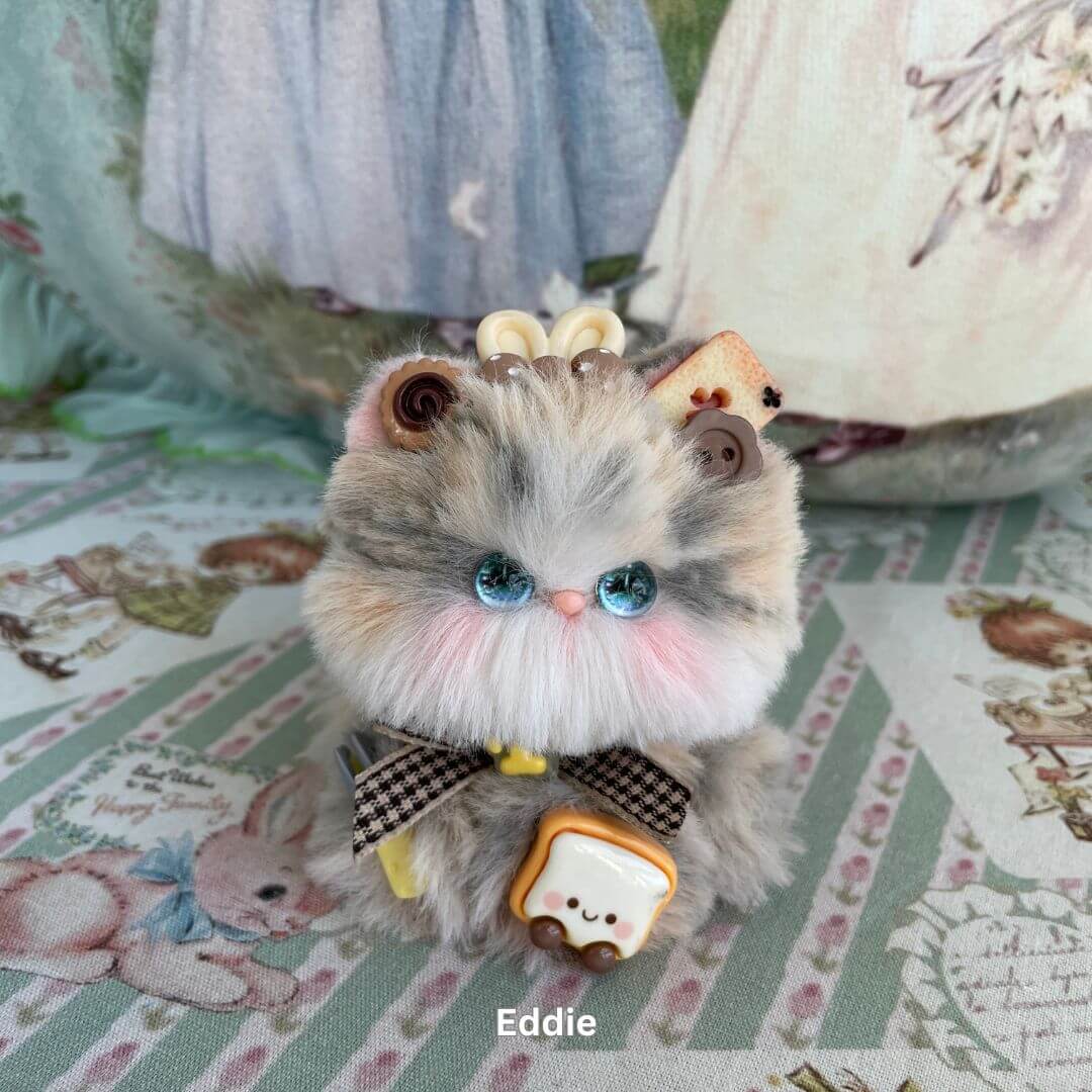Handmade plush kitten with bows and sweets from Cosplay Kitten Collection, inspired by fashion dolls and magical girls.