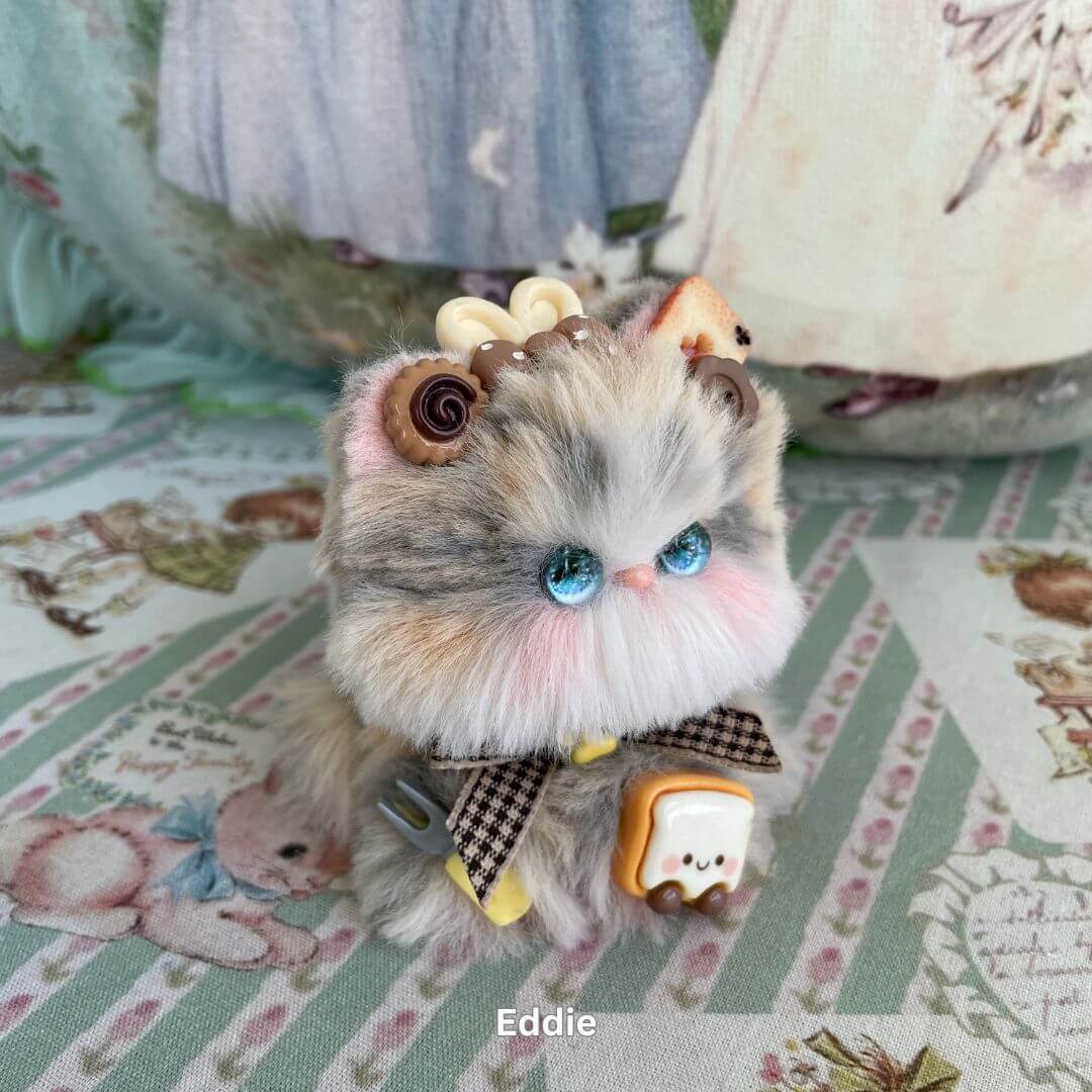 Handmade cosplay kitten plush with sweet adornments and bow, part of the Cosplay Kitten Collection.