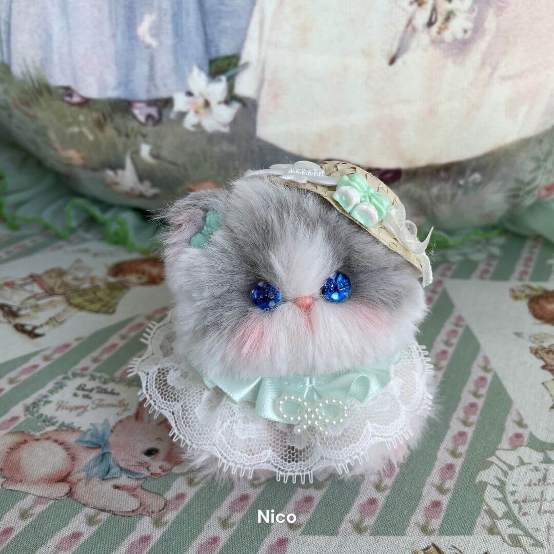 Handmade plush kitten toy in lace dress with blue eyes, part of the Cosplay Kitten Collection. Ideal as decoration or unique gift.