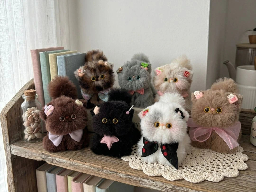 Handmade kitten companion displayed on a shelf or desk
