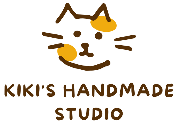 Logo of Kiki's Handmade Studio featuring a stylized cat face with artistic text.