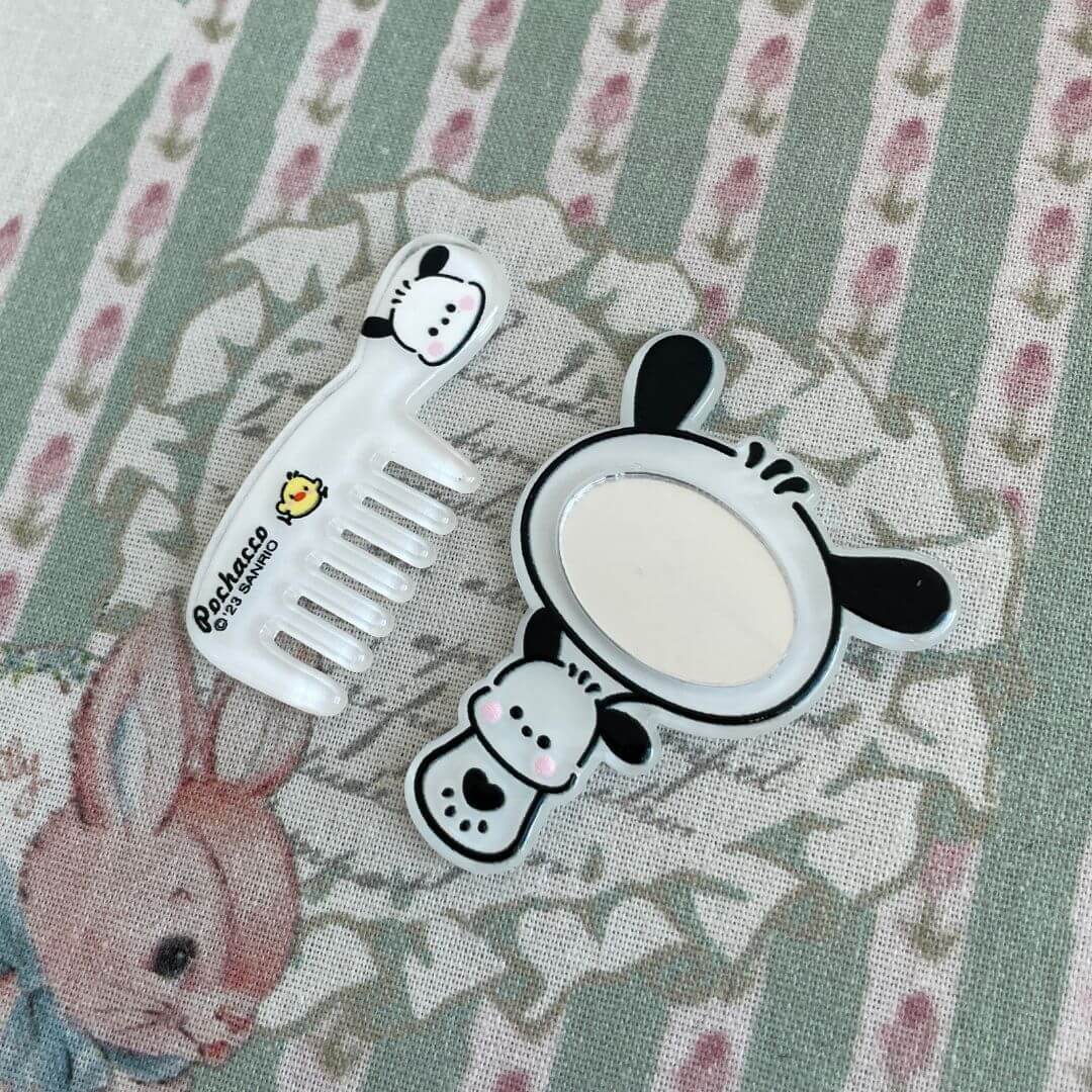 Cute black and white animal-themed mini comb and mirror set with a playful cow design, perfect for doll accessories or decoration.
