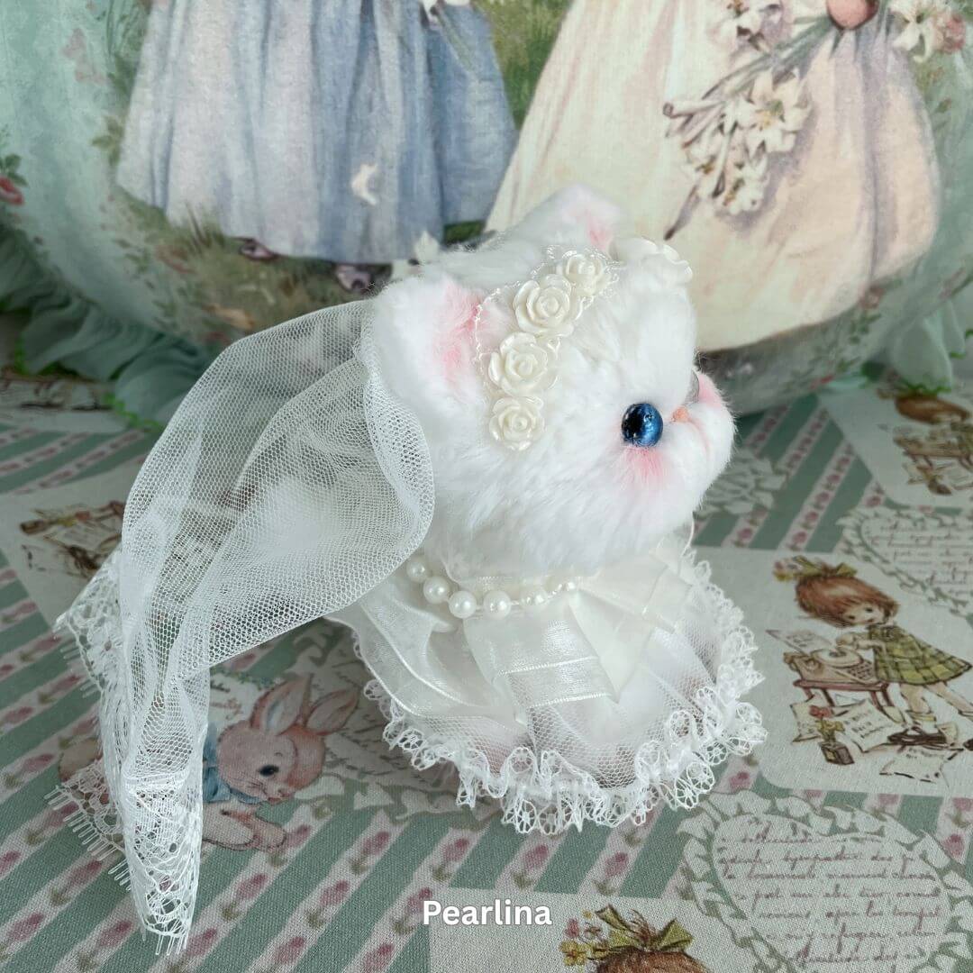 Elegant handmade plush kitten toy dressed as a bride, adorned with lace and pearls, from the Enchanted Big Paws Collection.