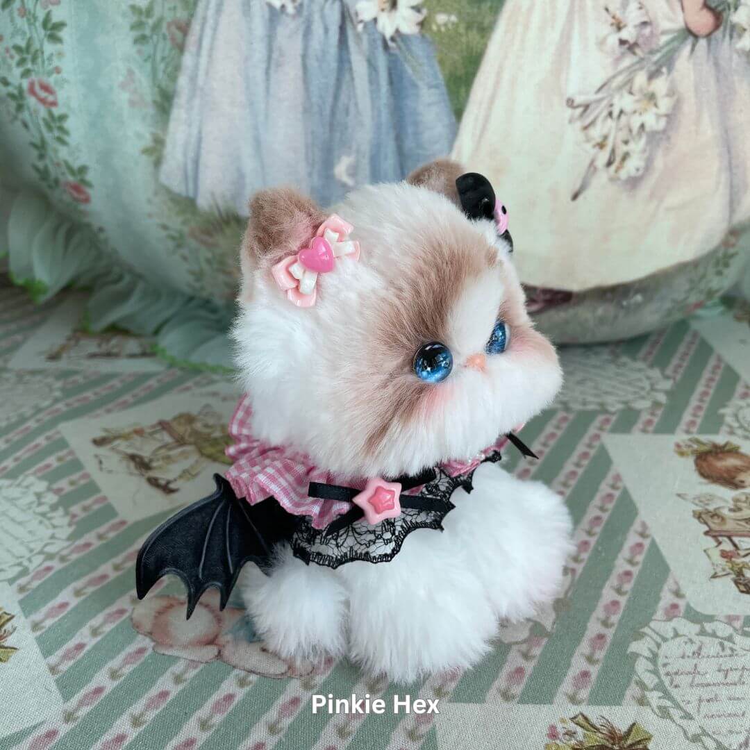 Handmade plush kitten toy from Enchanted Big Paws Collection with pink accessories, perfect for cat lovers and unique decor.
