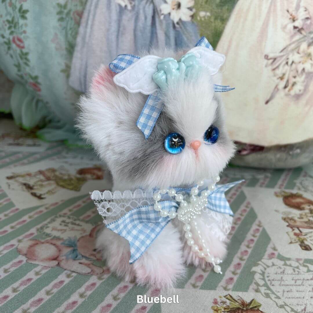 Handmade plush kitten toy from Enchanted Big Paws Collection by Aiko. Bluebell design with elegant bow and lace decoration. Perfect gift.