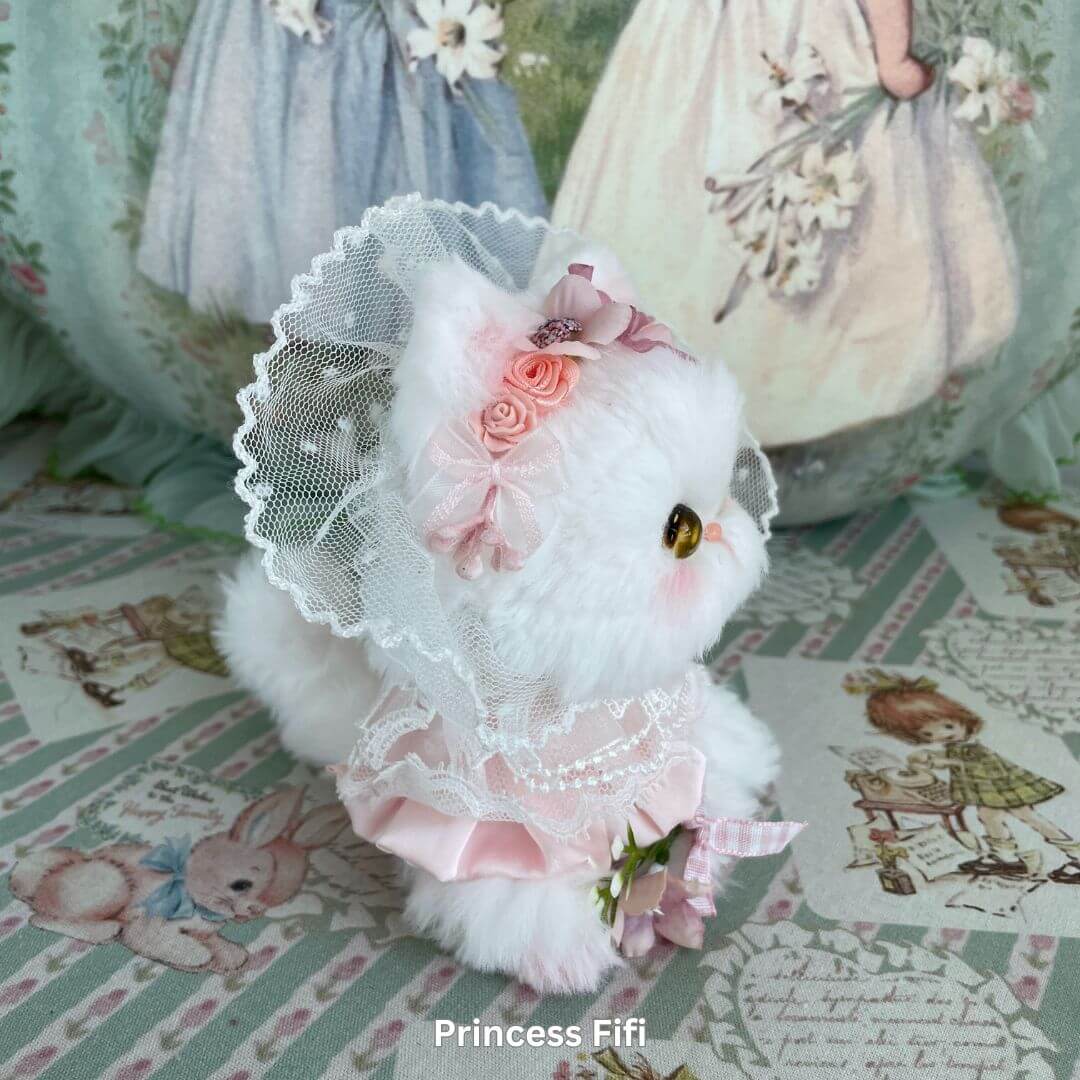 Handmade white kitten plush toy with lace and pink floral accessories from Enchanted Big Paws Collection for cat lovers.