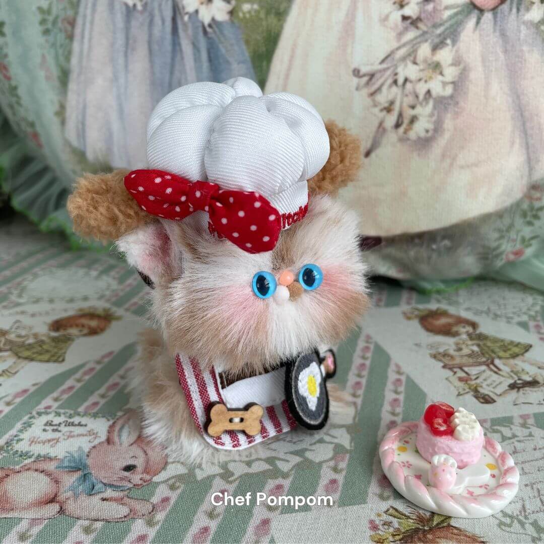 Handmade Chef Pompom kitten plush toy with chef hat, eco-friendly materials, adorable decor, UK-made collectible, cute kitten design