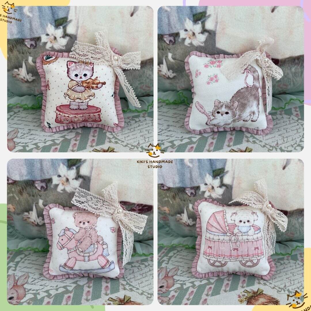 Handmade mini cuddle critter cushions featuring kittens and puppies with hand-stitched bows, perfect for dolls or as decorative accessories.