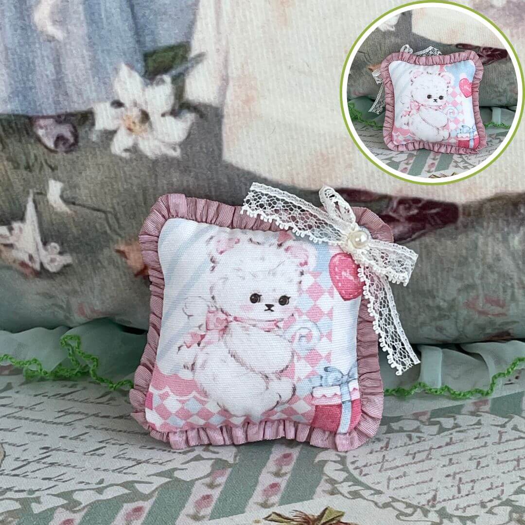 Handmade tiny cuddle critter cushion with a cute animal print, hand-stitched bow detail, perfect for dolls or decorative use.