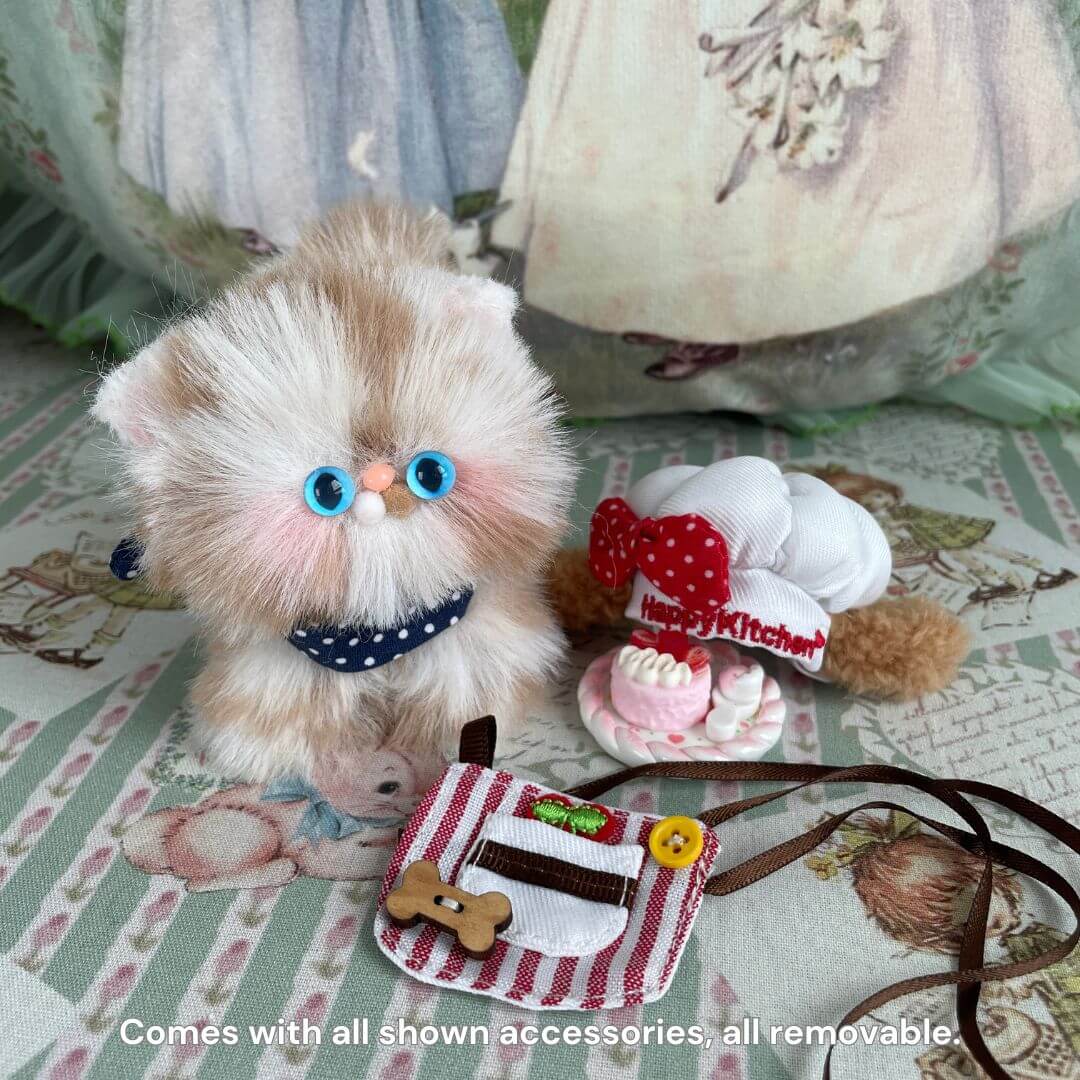 Handmade eco-friendly kitten plush toy with blue eyes, polka dot bow, and accessories. Perfect for gifts, collectibles, and home decor.