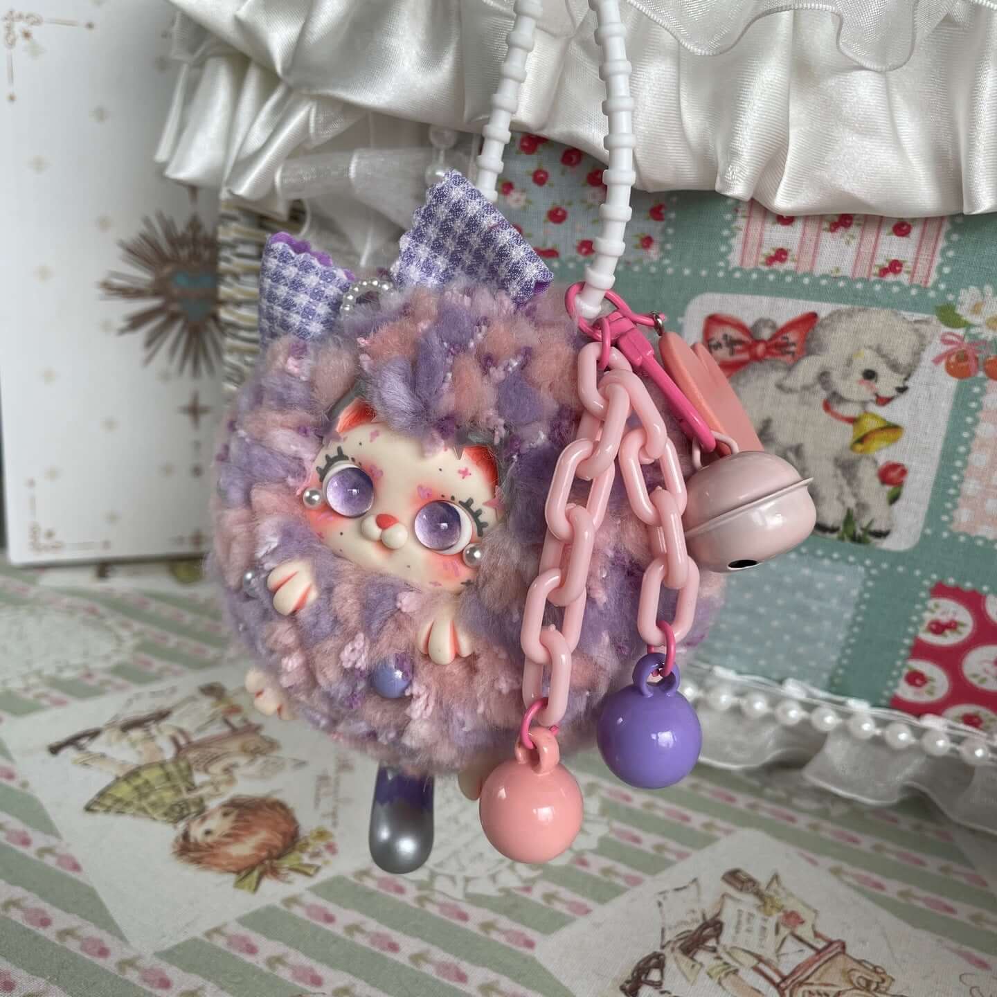 Handmade Fluffy Kitten Ball Pendant with multi-colored details, limited edition accessory for bags, showcasing cute design.