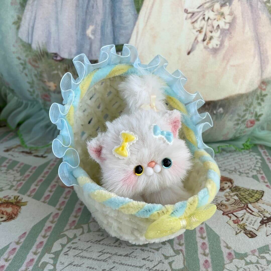 Handmade Whimsy Cradle with adorable plush kitten, adorned with pastel ribbons, nestled in a decorative miniature basket.