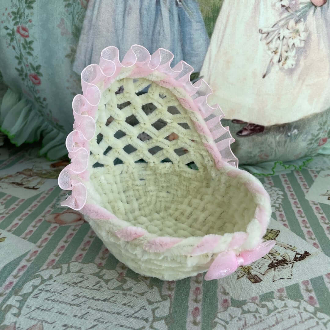Handmade whimsy cradle for kittens or puppies, pink ribbon accents, perfect for dollhouses or dioramas, adds charm and sweetness.