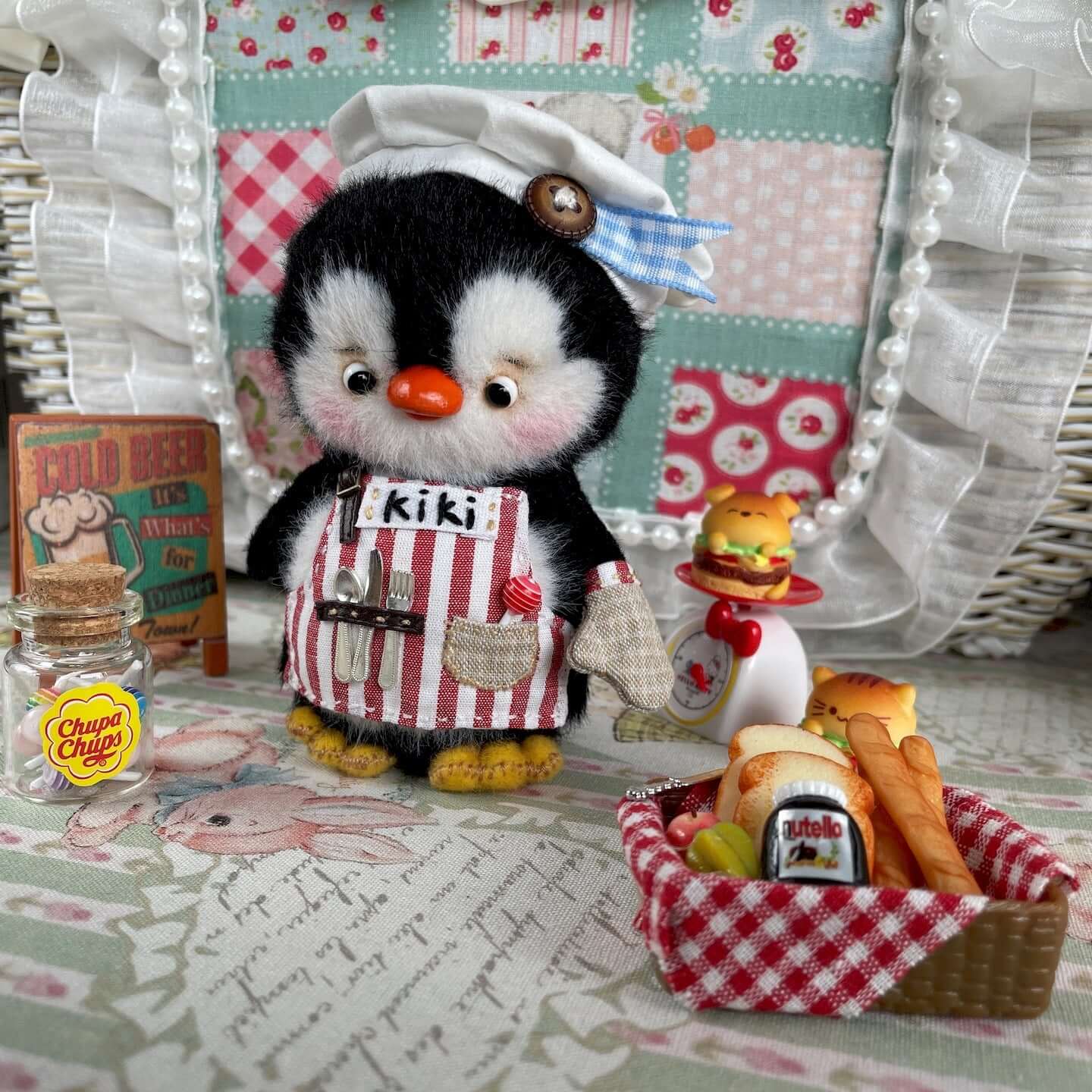Handmade mini chef penguin plush toy with apron and hat, featuring movable joints. Includes custom accessories and decor. Cute kitchen decor.