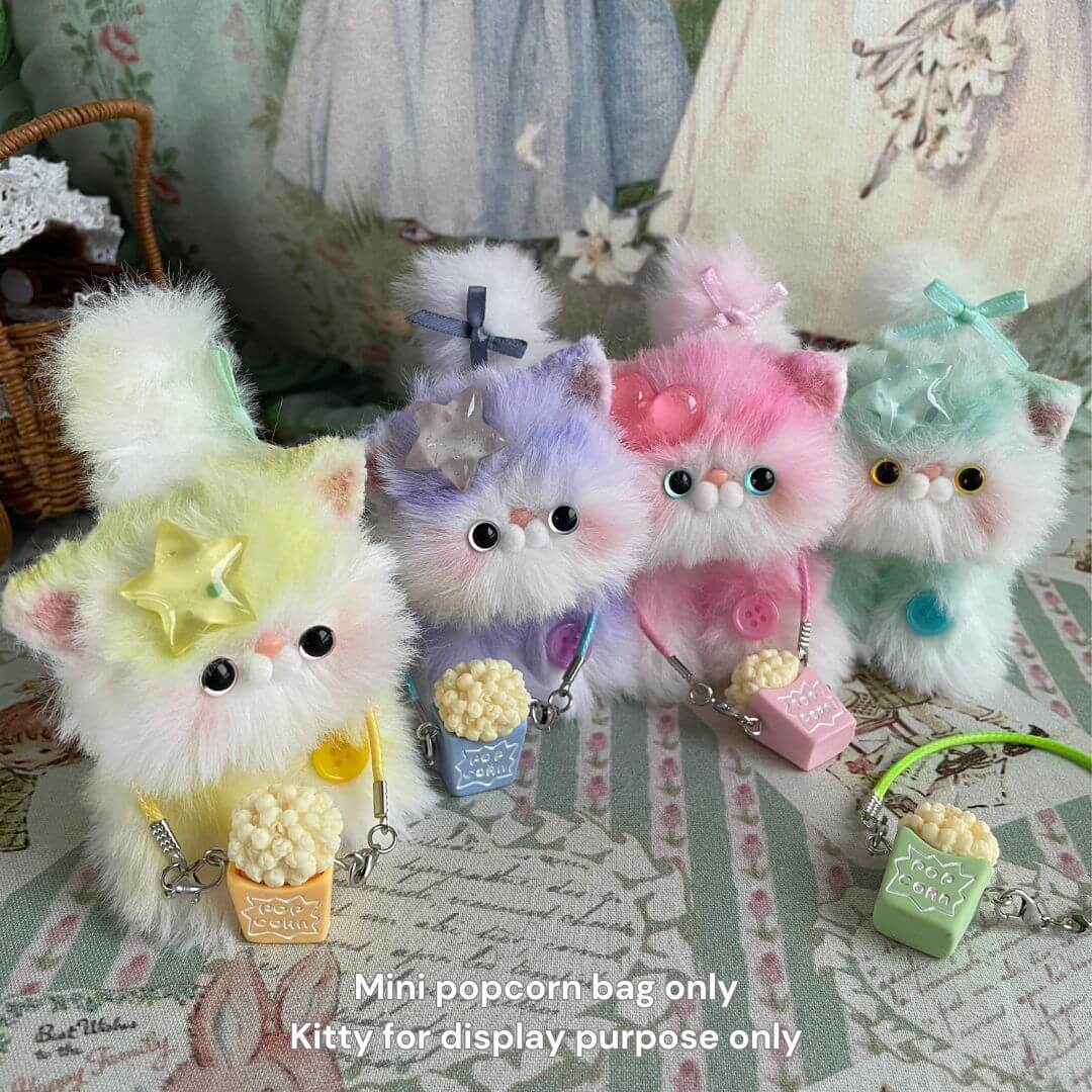 Mini Popcorn Crossbody Bag with handmade plush kitten toys in colorful display.