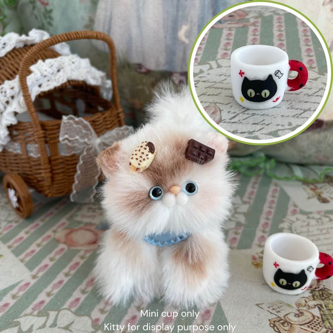 Miniature black kitty cup with handmade fluffy kitten plush, ideal decor for cat lovers and collectors, adds charm and whimsy.