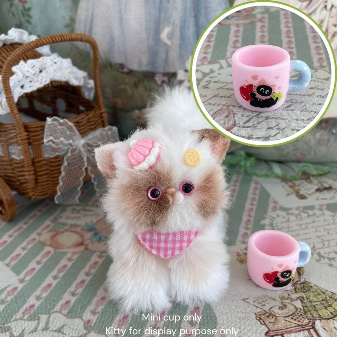 Decorative miniature black kitty cup and fluffy kitten, perfect for dollhouse decor or gifts, on a vintage-inspired background.