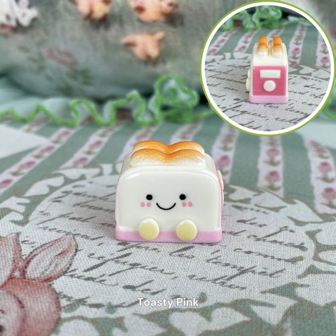 Cute Toasty Pink plush toy resembling toast, part of Snackie Friends collection, on a patterned background with floral accents.