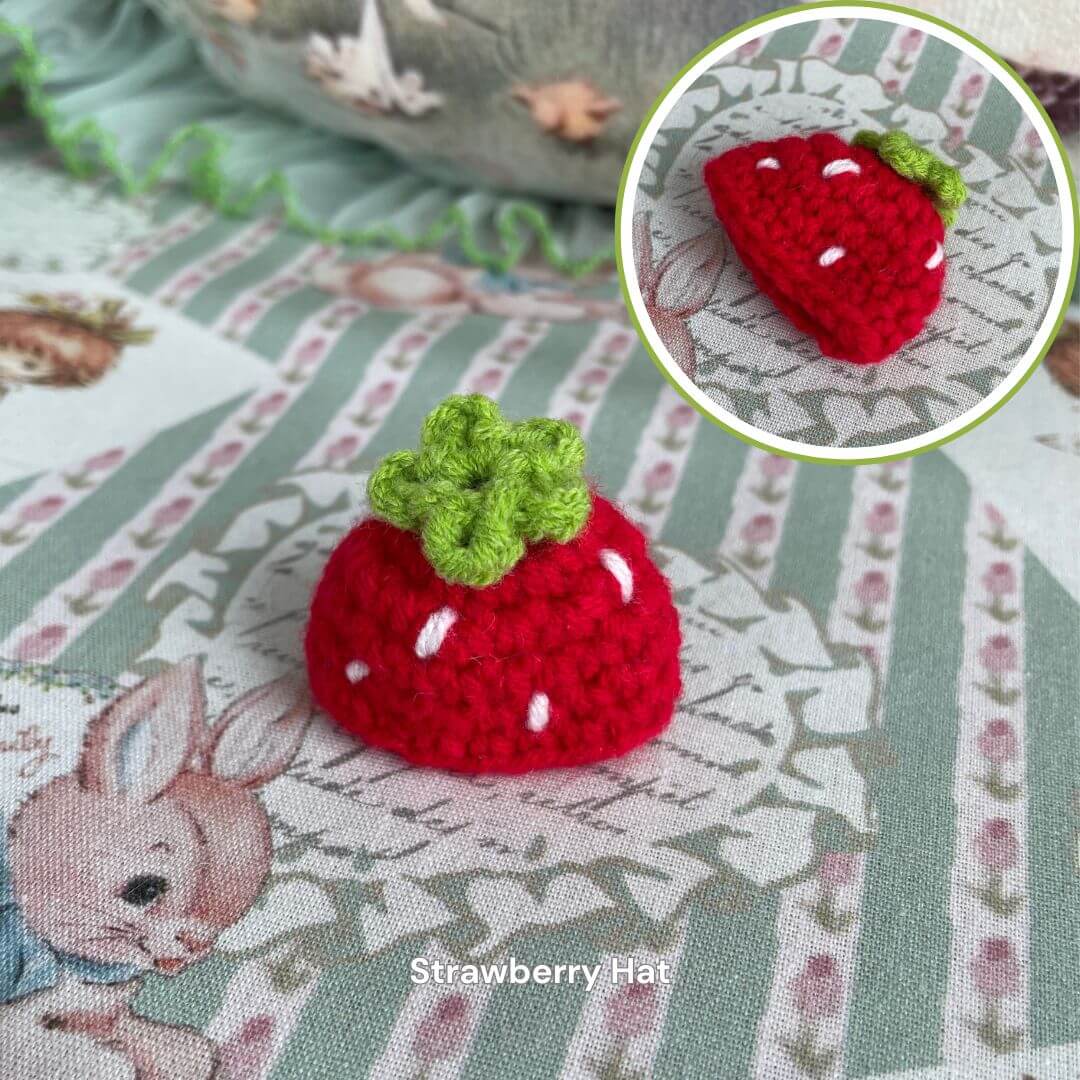 Handmade strawberry hat for plush toys, featuring a cute red crochet design perfect for dressing up your stuffed animals.
