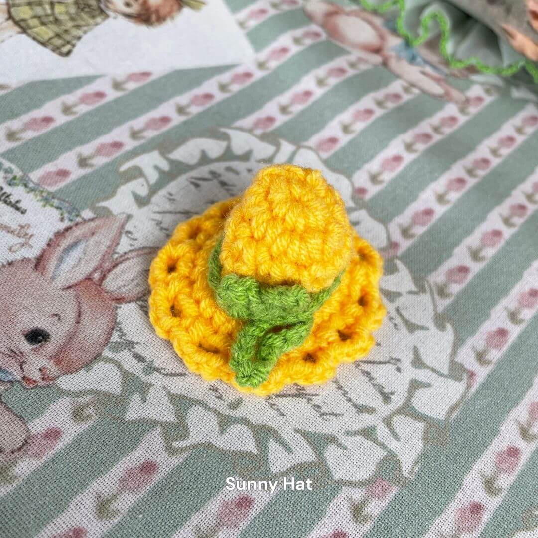 Yellow crochet sunny hat for plush toys, ideal accessory for kittens and puppies, part of Snuggle Bits handmade fashion collection.