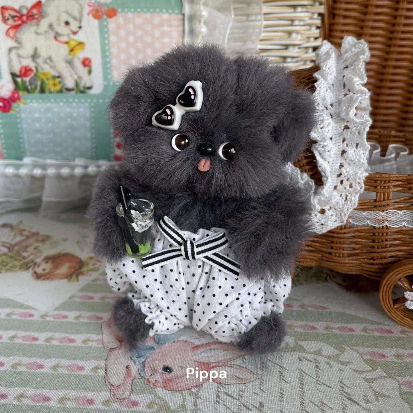Handmade plush toy kitten "Pippa" with grey fur and polka dot outfit, featuring a cute bow accessory, perfect for decoration.