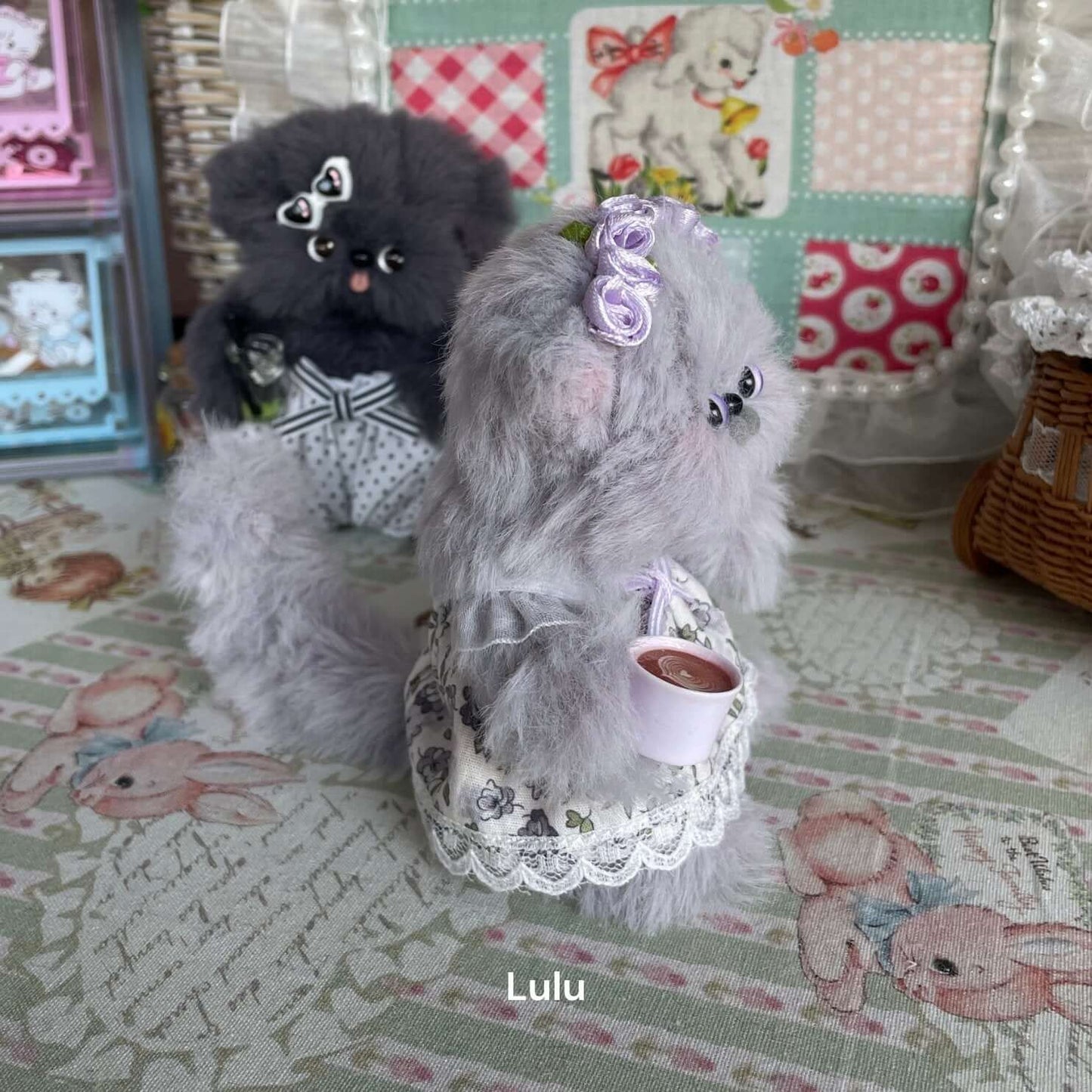 Handmade Tea Time Kitten plush toy in a floral dress, holding a cup, perfect for decoration and cat lovers. Unique gift by artist Kiki.