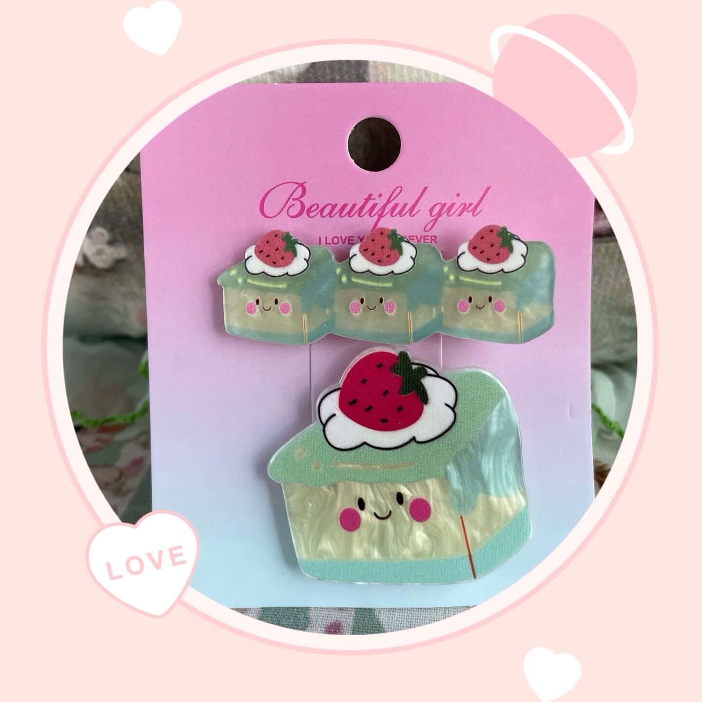 Cute strawberry-themed hair clips set for girls, featuring adorable smiling designs, perfect for accessorizing bags or clothing.