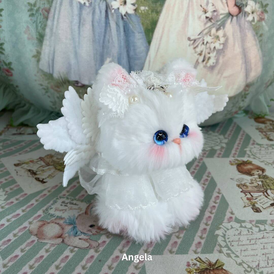 Handmade white plush toy kitten with wings and lace, part of Enchanted Big Paws Collection, designed by Aiko from Kiki's Handmade Studio.