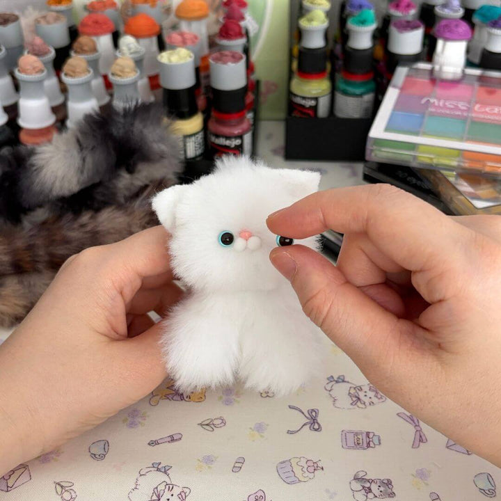 Adding eyes, nose and little touches to a handmade companion