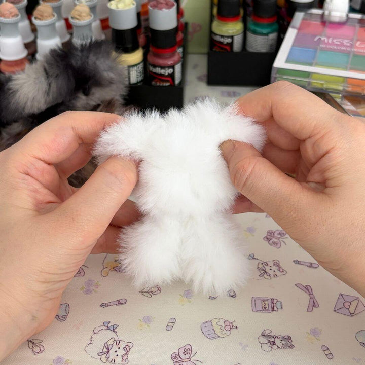 Hands shaping a handmade companion