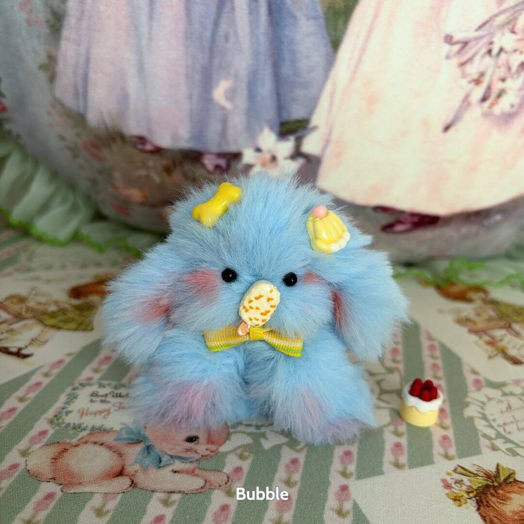 Adorable Bunny Collection featuring a cute, fluffy blue bunny with accessories, ice cream cone, and pastel colors.