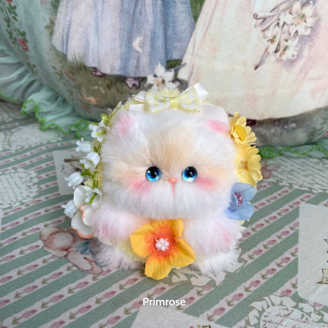 Blossom Kitten Collection: handmade kitten with fluffy pastel fur, floral accents, and big blue eyes, styled for charm.