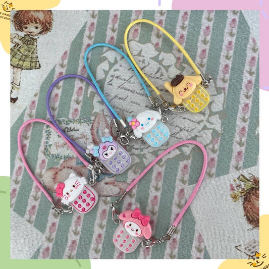 Charmie Dial phone charms with Sanrio characters and colorful dial pads, perfect as cute accessories for plush toys or gifts.