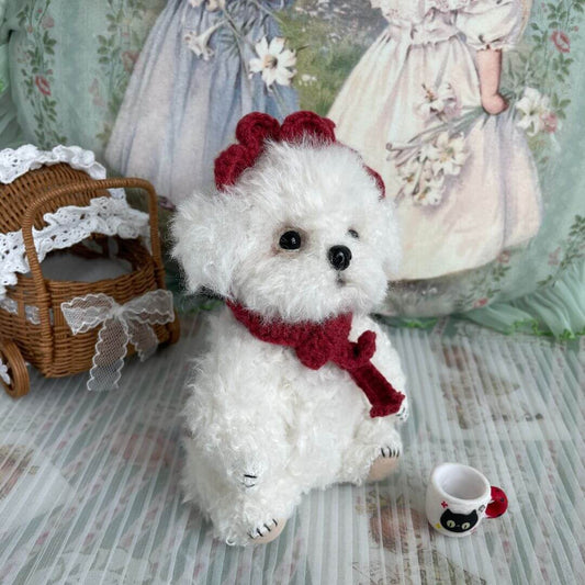 Cuddly Curly Teddy Dog with scarf and lace accessory, sitting beside a wicker stroller and a cup, handmade by Kiki's Studio, 16cm tall.