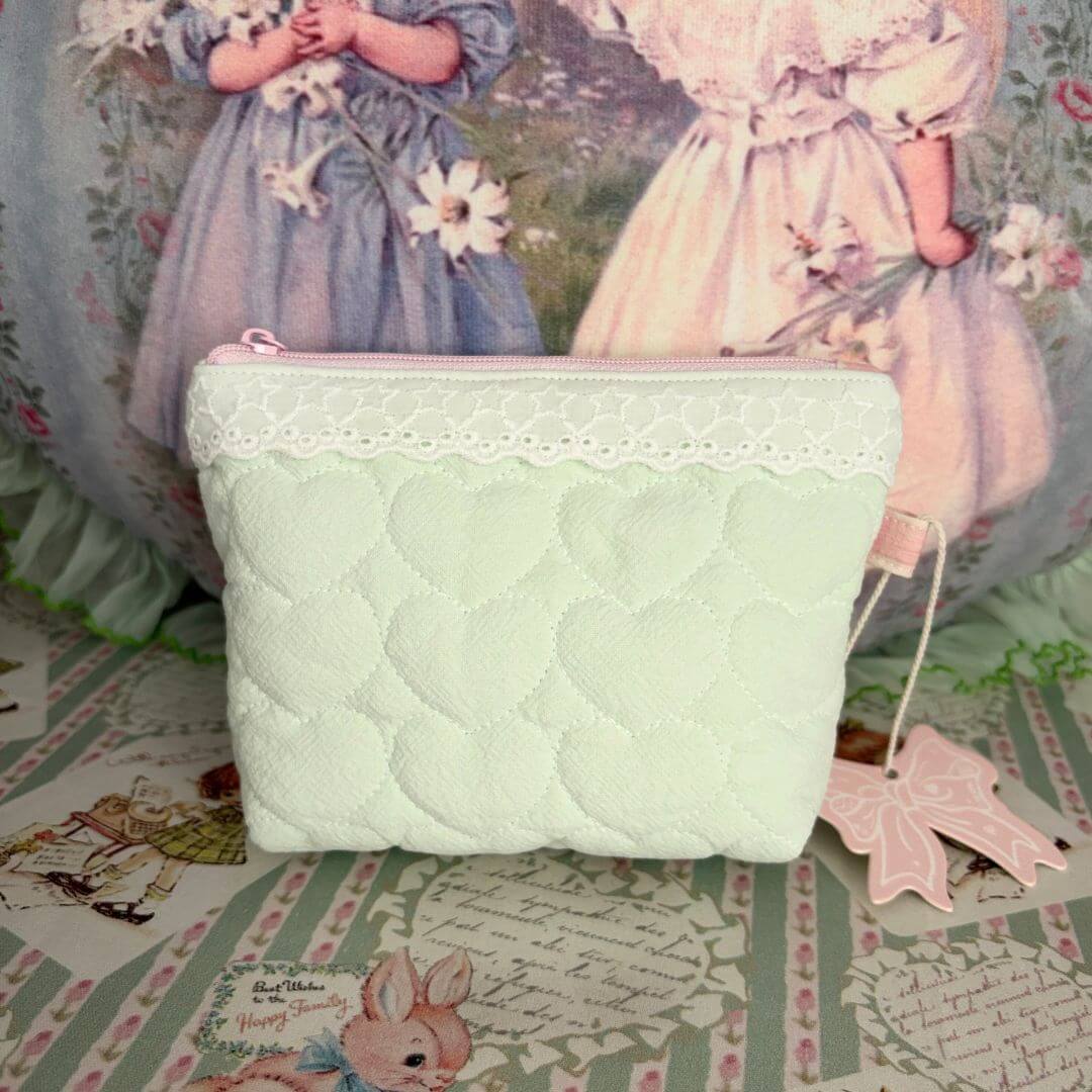 Cute Handmade Cotton Quilted Pouch – Small Everyday Organizer in soft mint green with heart patterns, lace trim, and pink charm.