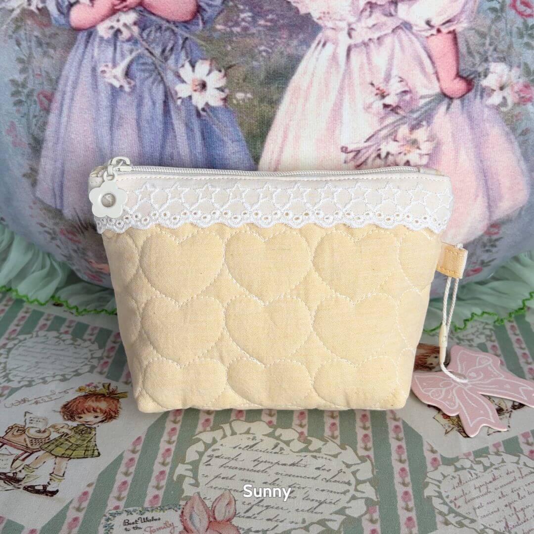 Cute Handmade Cotton Quilted Pouch – Small Everyday Organizer in pastel yellow with heart patterns and lace accents.