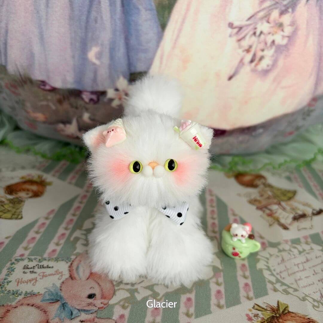 Handmade fluffy kitten figurine from the White Kitten Collection, with pastel bow and candy accessory, styled in a kawaii theme.