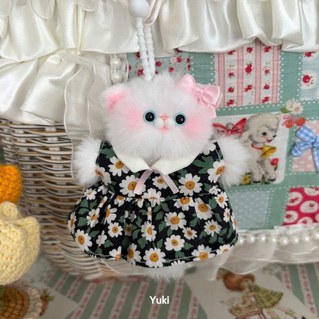 Pawsh Pendants: Fluffy kitten figurine in black floral dress with pink bow, handmade in UK, cute animal collectible.