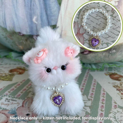 Elegant Heart Necklace on a fluffy kitten figurine with a purple heart pendant, showcasing a cute and kawaii design.