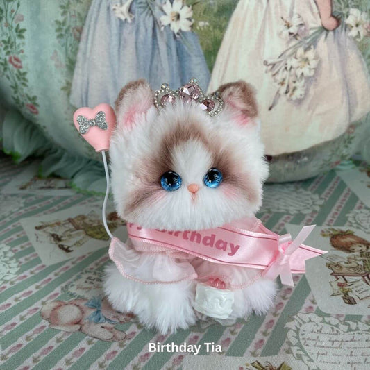 Handmade plush kitten toy from Enchanted Big Paws Collection, wearing a birthday sash, perfect for decor and cat lovers.