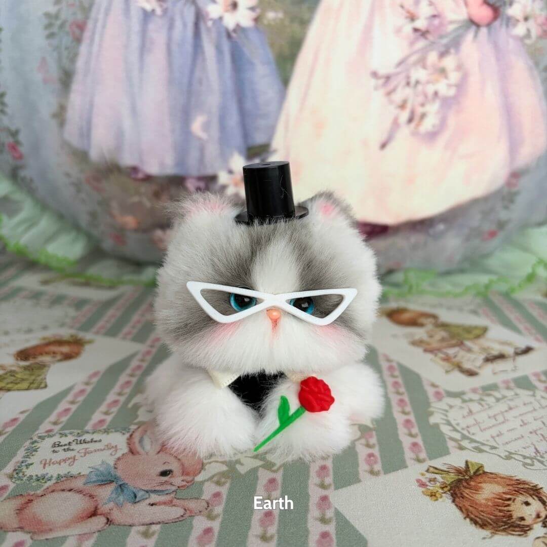 Alt Tag: Moonbound Companions fluffy kitten figurine with glasses and a top hat, holding a rose, themed in fantasy style.