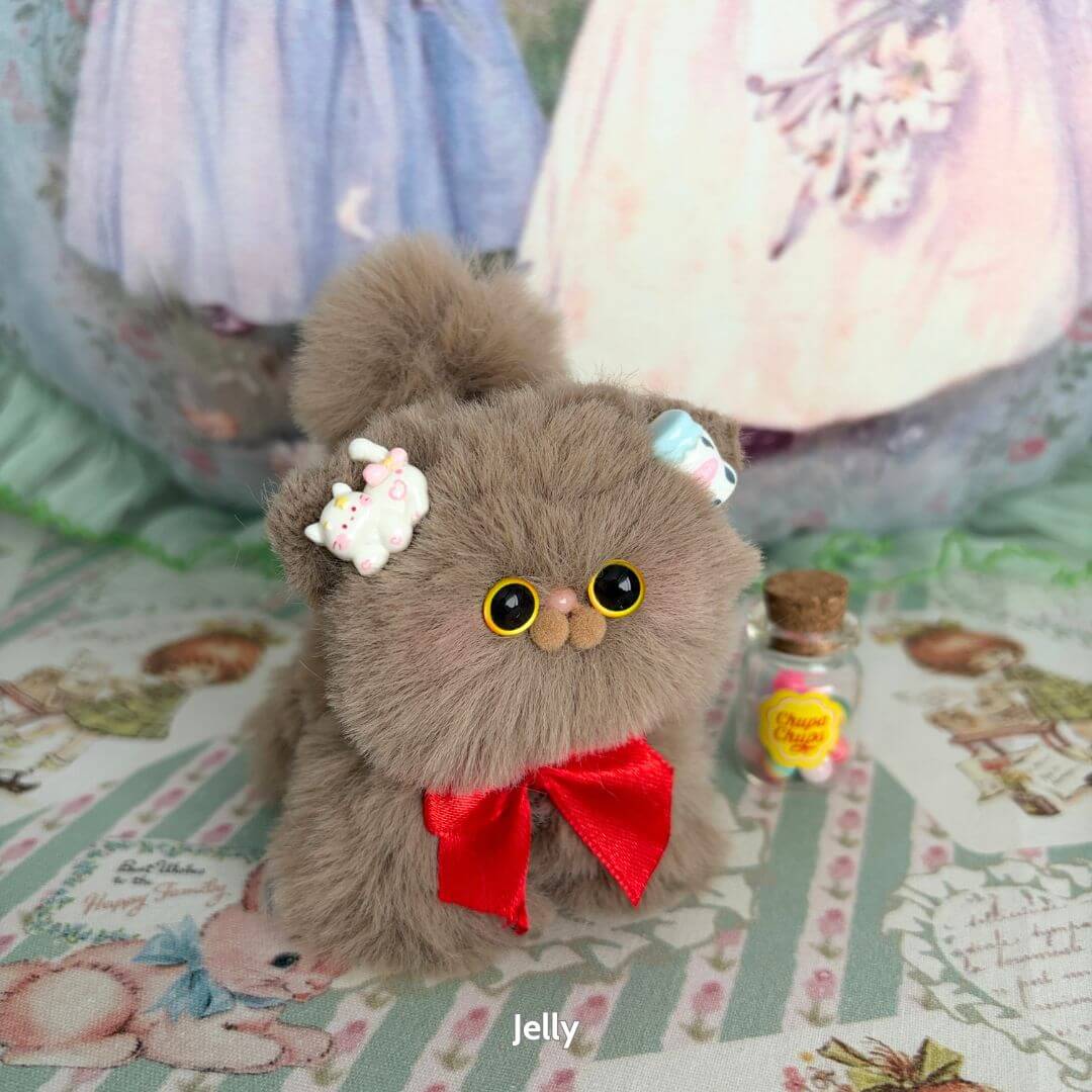 Fluffy Kitten Collection: adorable fluffy grey kitten with cute accessories, red bow, miniature cat figurine, kawaii style