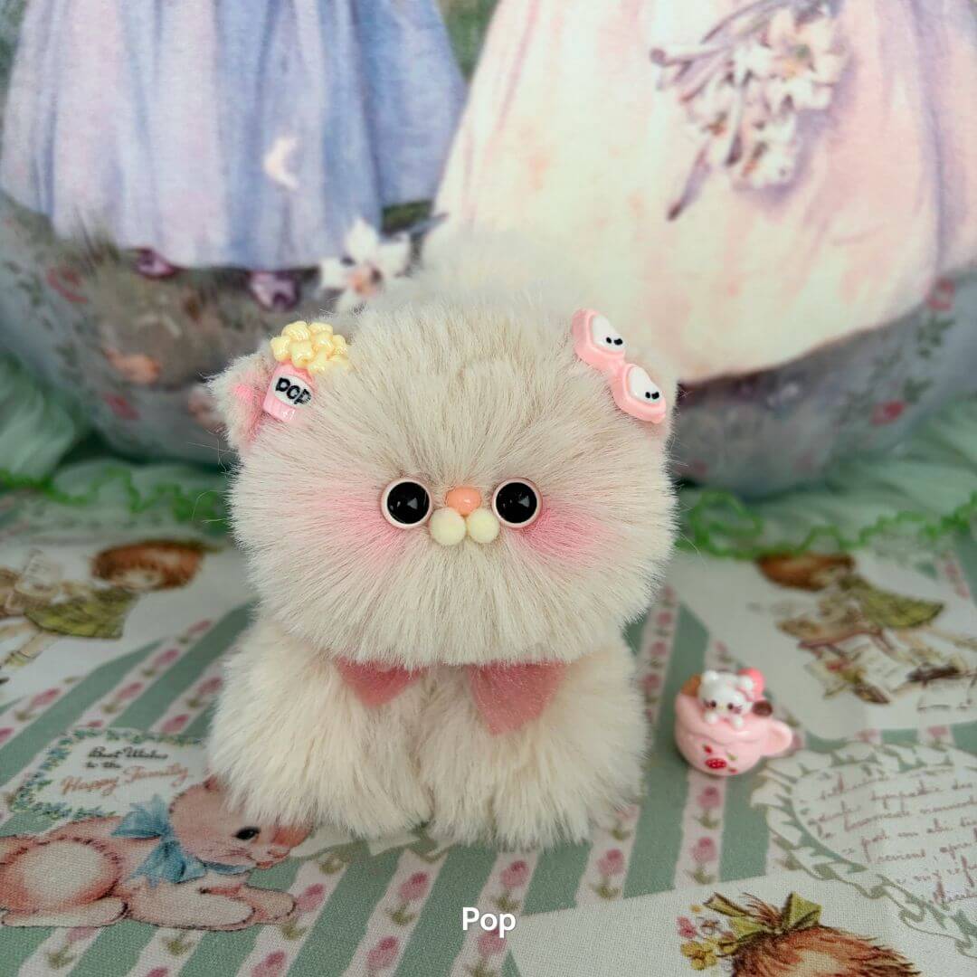 Fluffy Kitten Collection: cute fluffy cat figurine with pastel colors, bows, and a cheerful expression, handmade in UK.