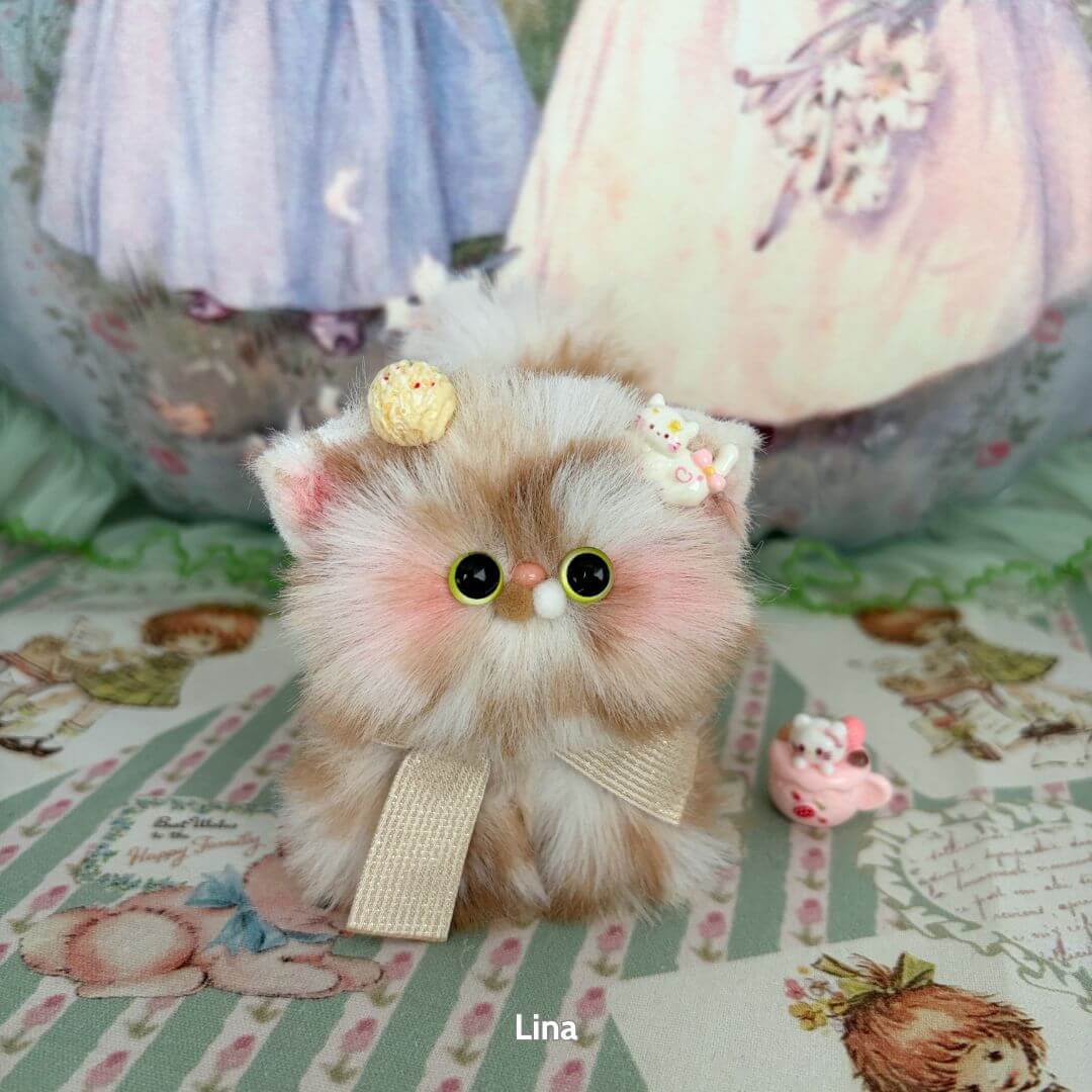 Adorable fluffy kitten figurine with pastel colors and cute accessories, showcasing the Fluffy Kitten Collection.