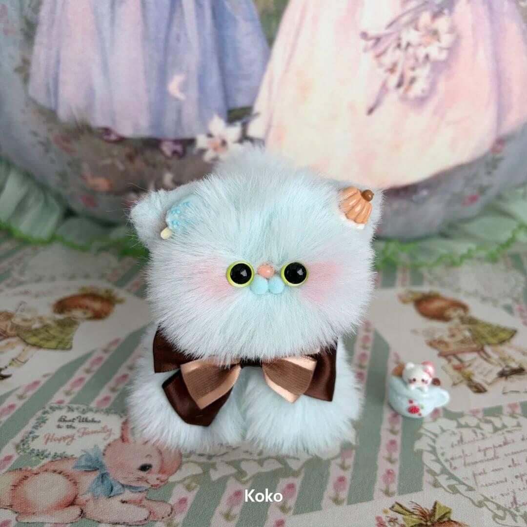Fluffy Kitten Collection: Handmade kitten figure in pastel blue with cones, bows, and a cute collectible vibe.