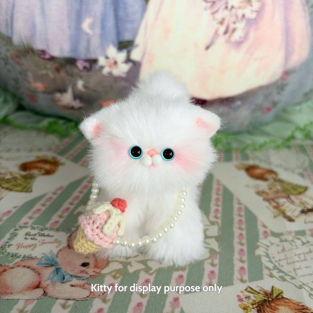Fluffy white handmade kitten figurine with pearl necklace and cupcake accessory, part of Snuggle Bits collection, cute animal collectible.